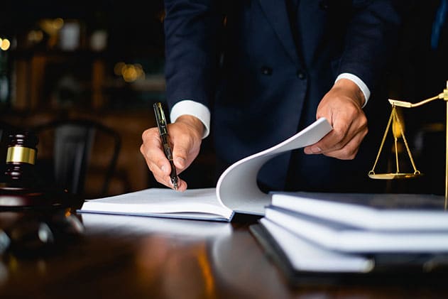 lawyer signing legal documents